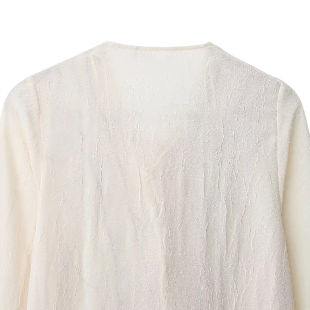 Isla | Blouse crème avec finition à volants contrastés