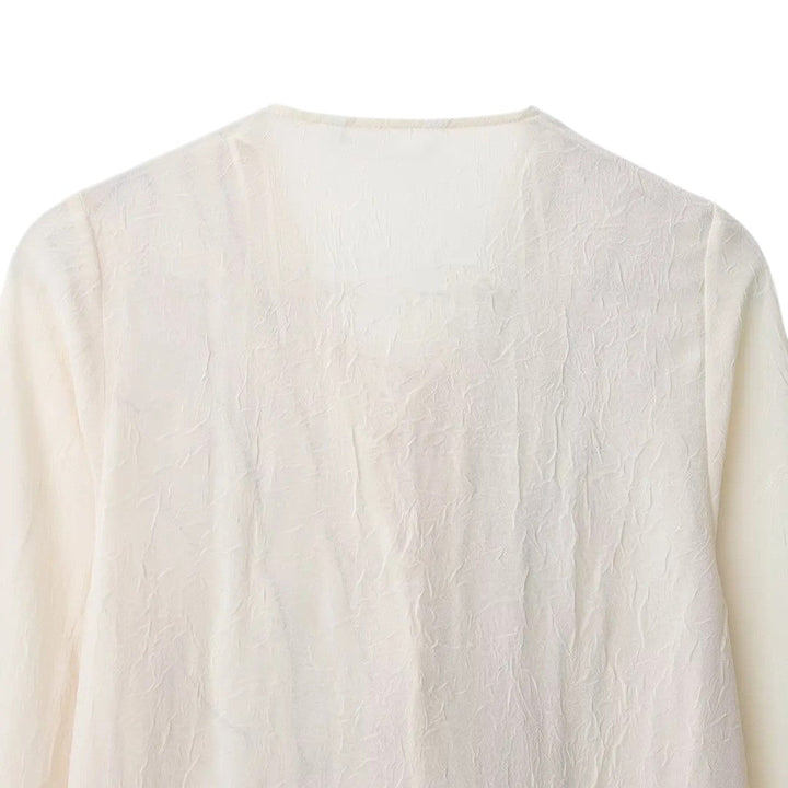 Isla | Blouse crème avec finition à volants contrastés