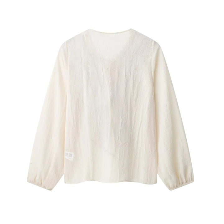 Isla | Blouse crème avec finition à volants contrastés