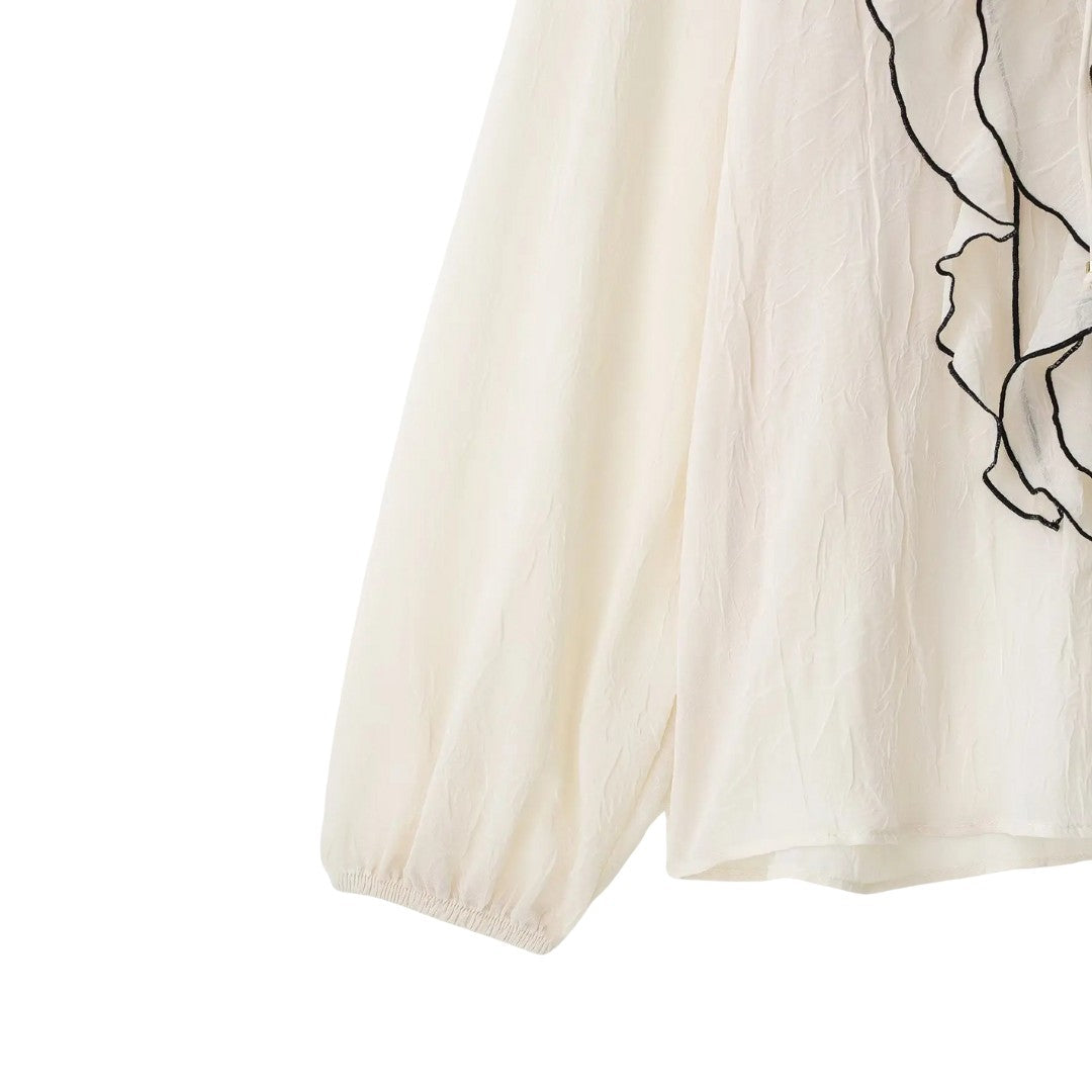 Isla | Blouse crème avec finition à volants contrastés