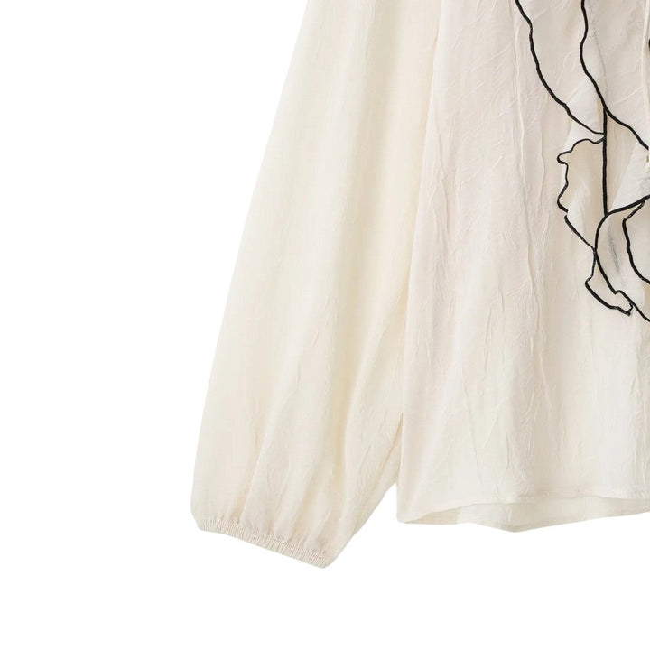 Isla | Blouse crème avec finition à volants contrastés